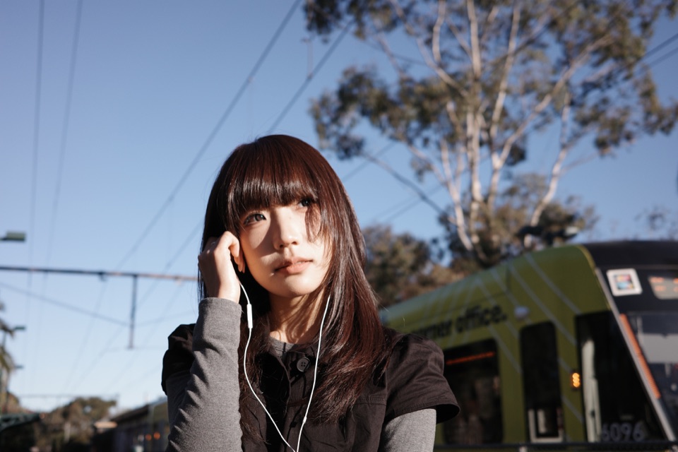 Portrait in front of a moving Melbourne tram