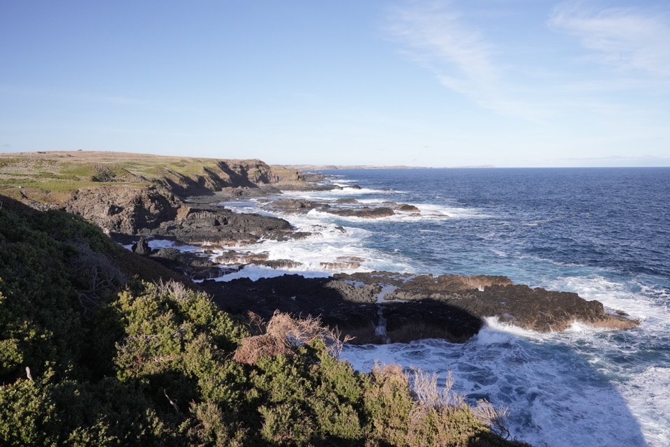 Rock formations meeting the open sea
